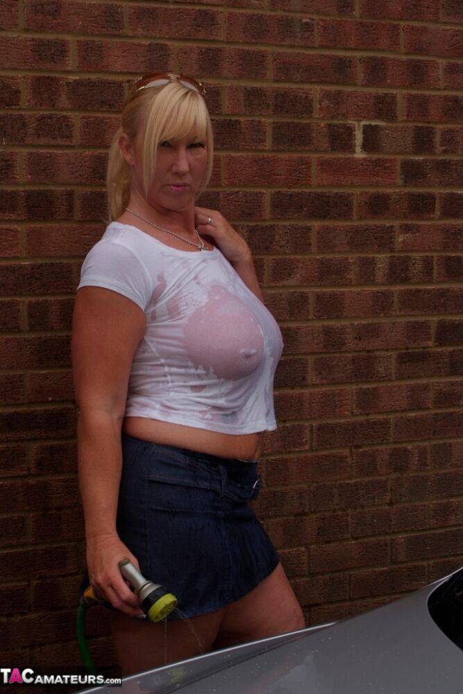 Big titted blonde amateur Melody soaks a white T-shirt while washing her car - #9