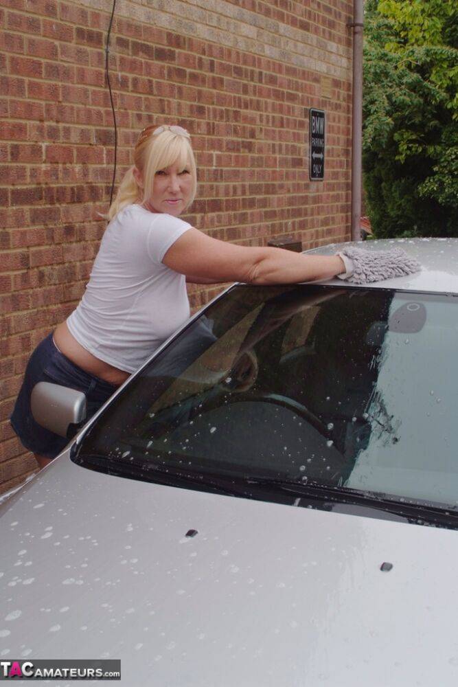 Big titted blonde amateur Melody soaks a white T-shirt while washing her car - #1