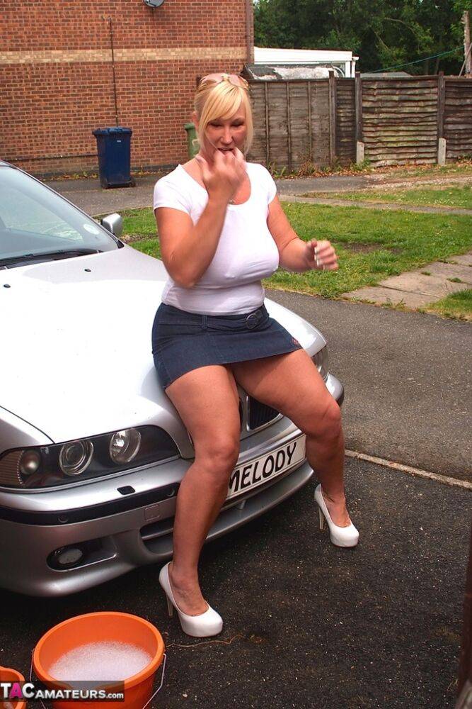 Big titted blonde amateur Melody soaks a white T-shirt while washing her car - #15