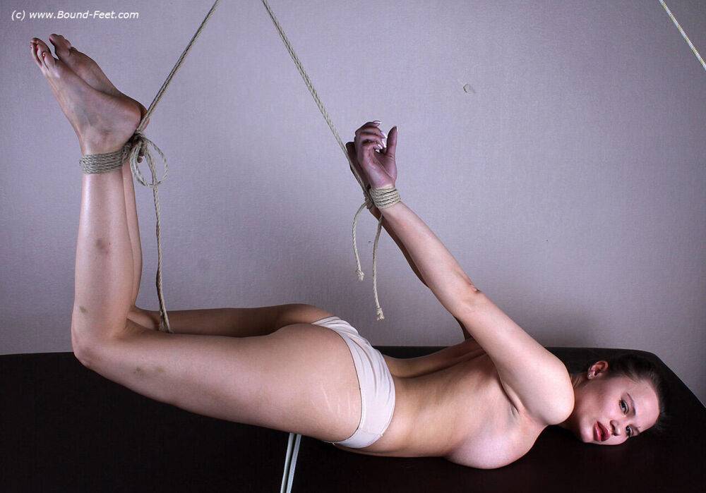 White girl Peggy is suspended in the air by ropes while in white underwear - #7