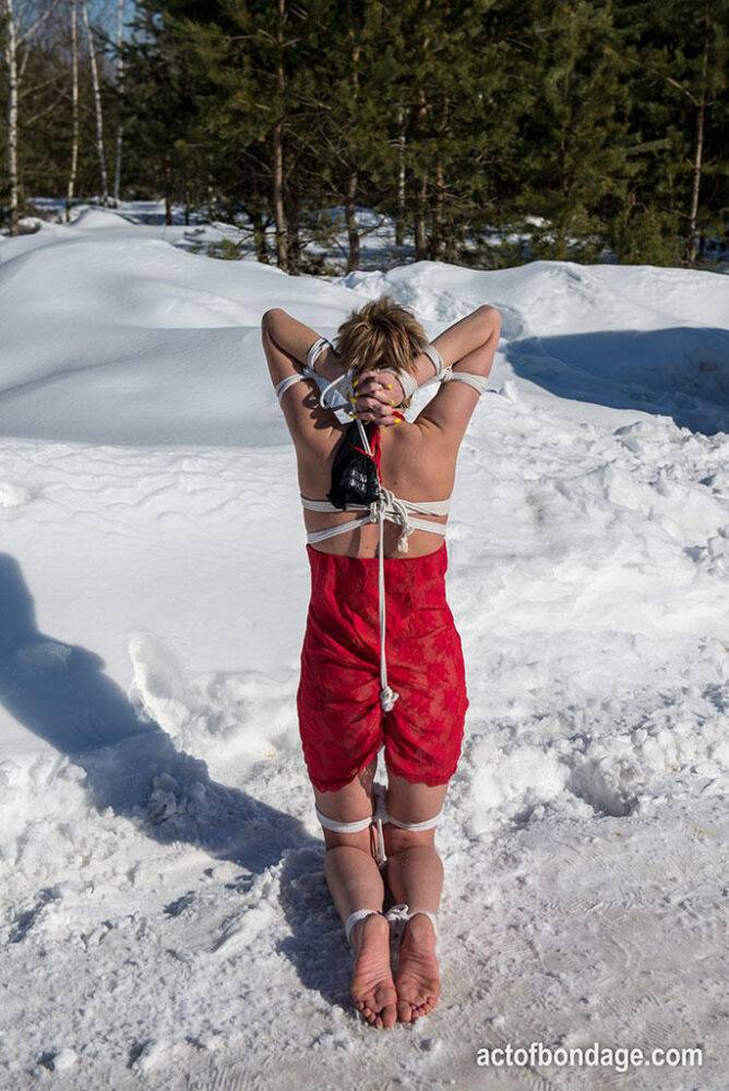 White female is toed up and forced to stand and kneel in snow - #16