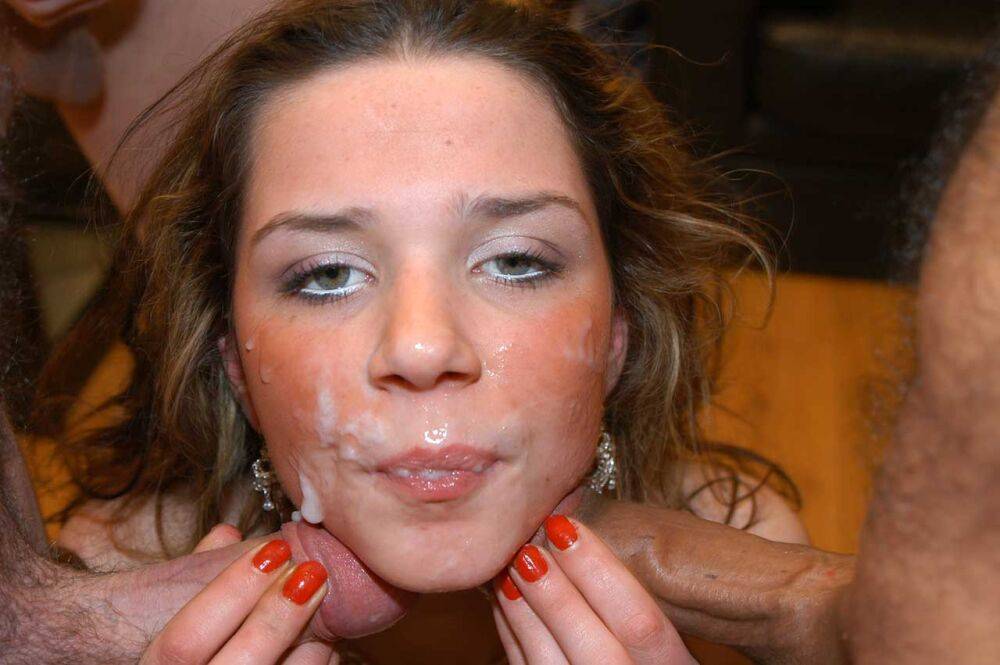 White teen Holly gets cum dumped on her willing face at a bukkake party - #9