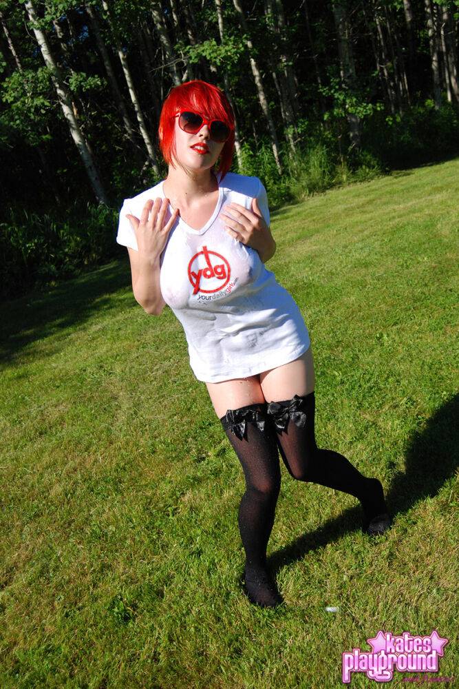 Redheaded amateur Sabrina soaks her white T-shirt out on a lawn in sunglasses - #6