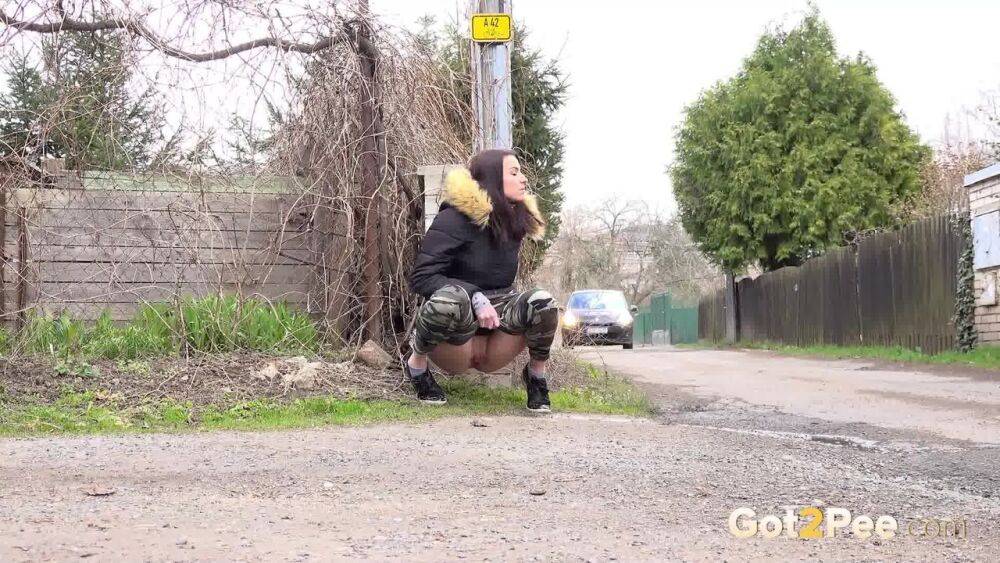 White girl Victoria Daniels takes a piss next to a pole beside a road - #13