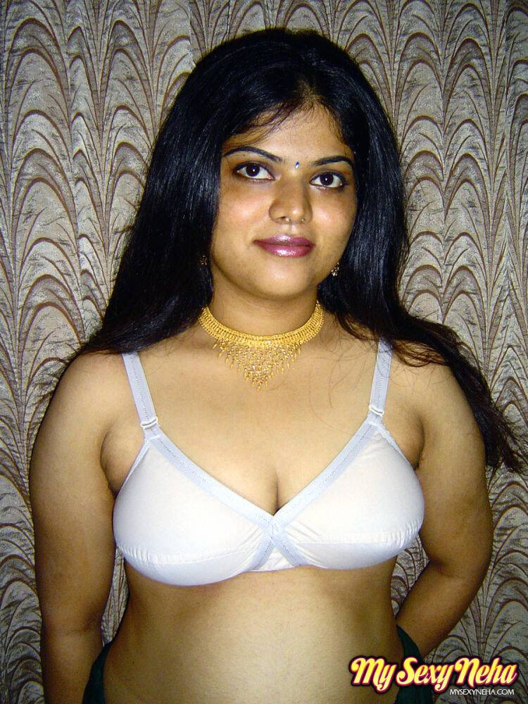 Chubby Indian girl Neha Nair lets her boobs spill forth from white bra - #6