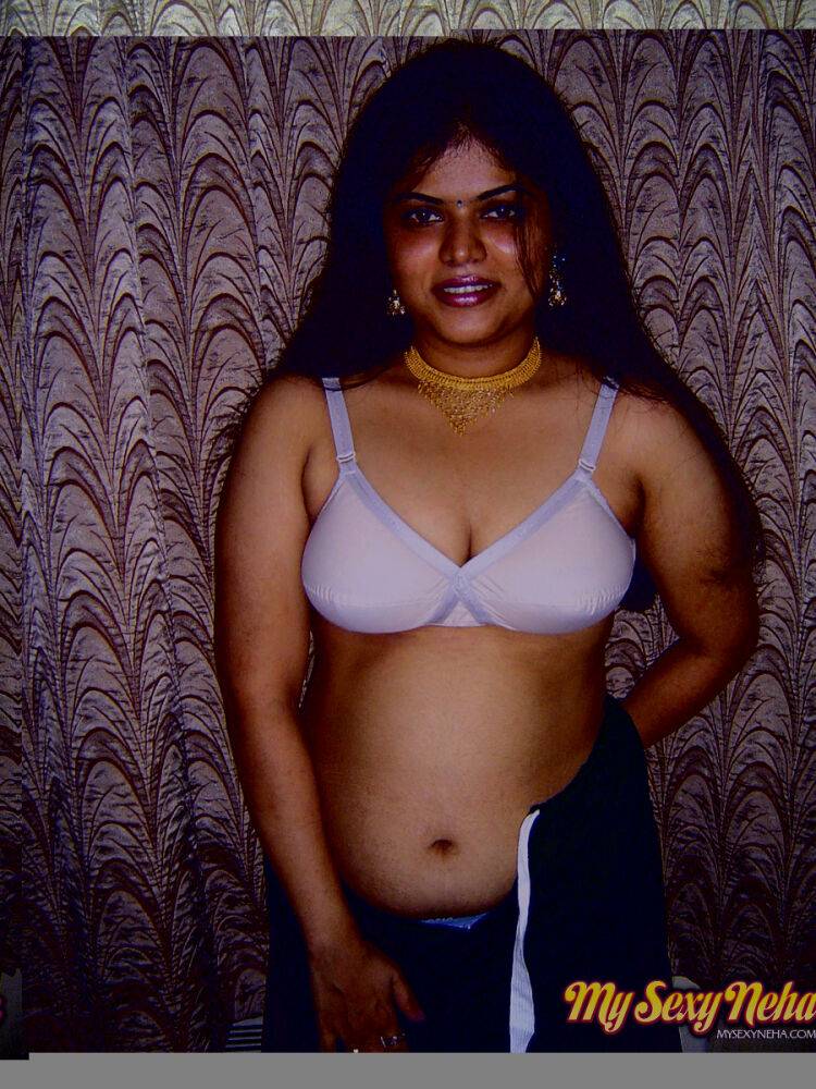 Chubby Indian girl Neha Nair lets her boobs spill forth from white bra - #7