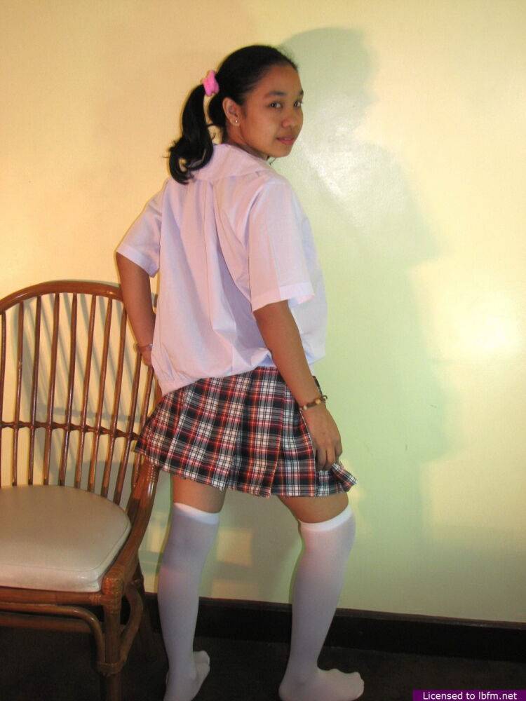 Asian schoolgirl Maryjane reveals her bald pussy in white over the knee socks - #10