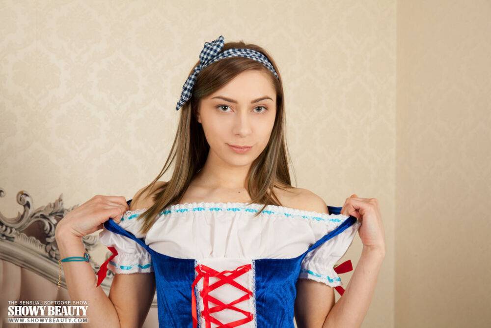 Charming young girl removes a Snow White outfit to pose in the nude - #13