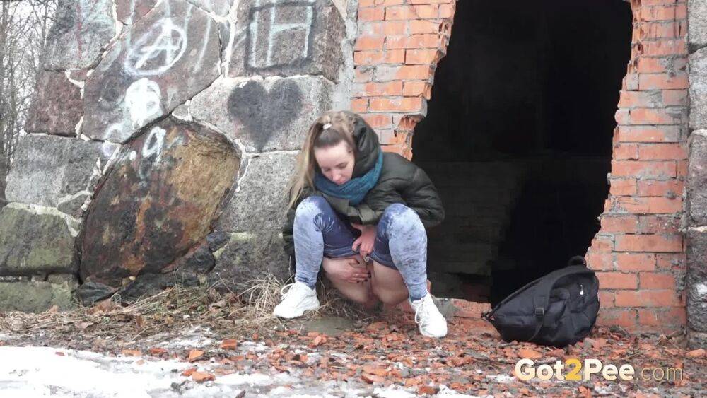 White girl pulls down her jeans for a badly needed pee on snow-covered ground - #6