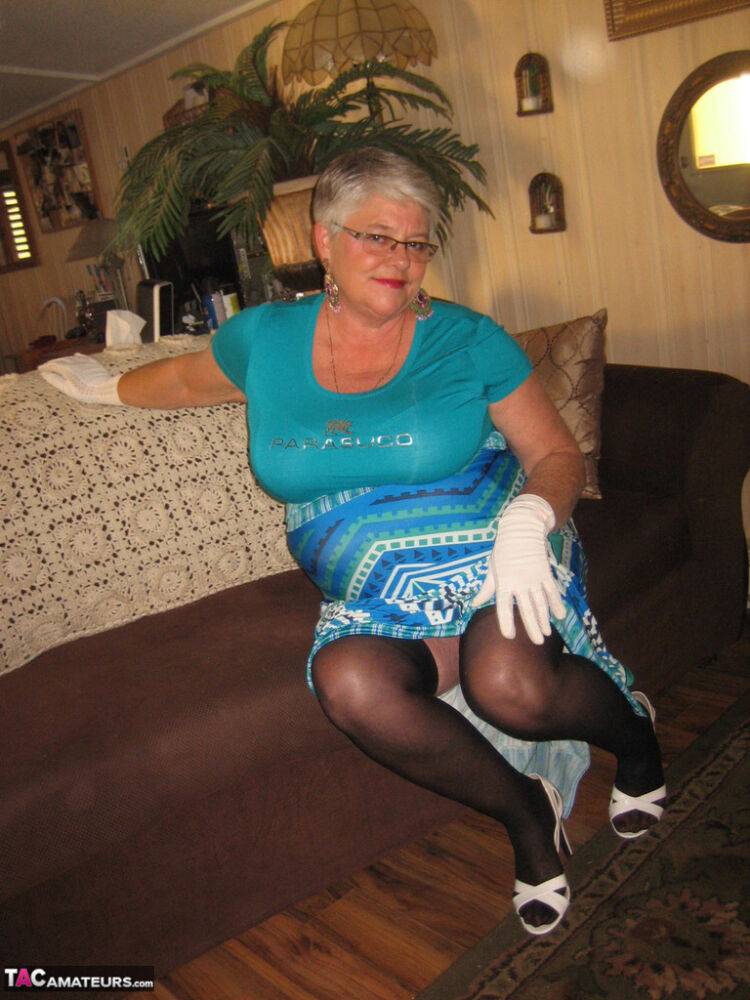 Fat Oma Girdle Goddess wears white gloves while disrobing to a bra and girdle - #6