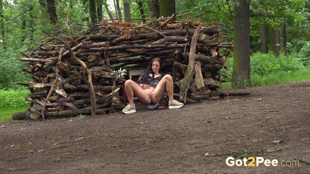 White girl Isabel Dark takes a pee in front of a troll's home in the woods - #14