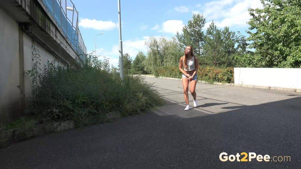 White girl Lucka pulls down jeans shorts for a pee on the side of a road - #9