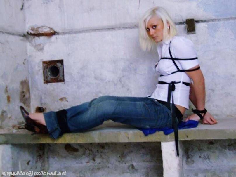 British woman is tied up and gagged in blue jeans and a white shirt - #2