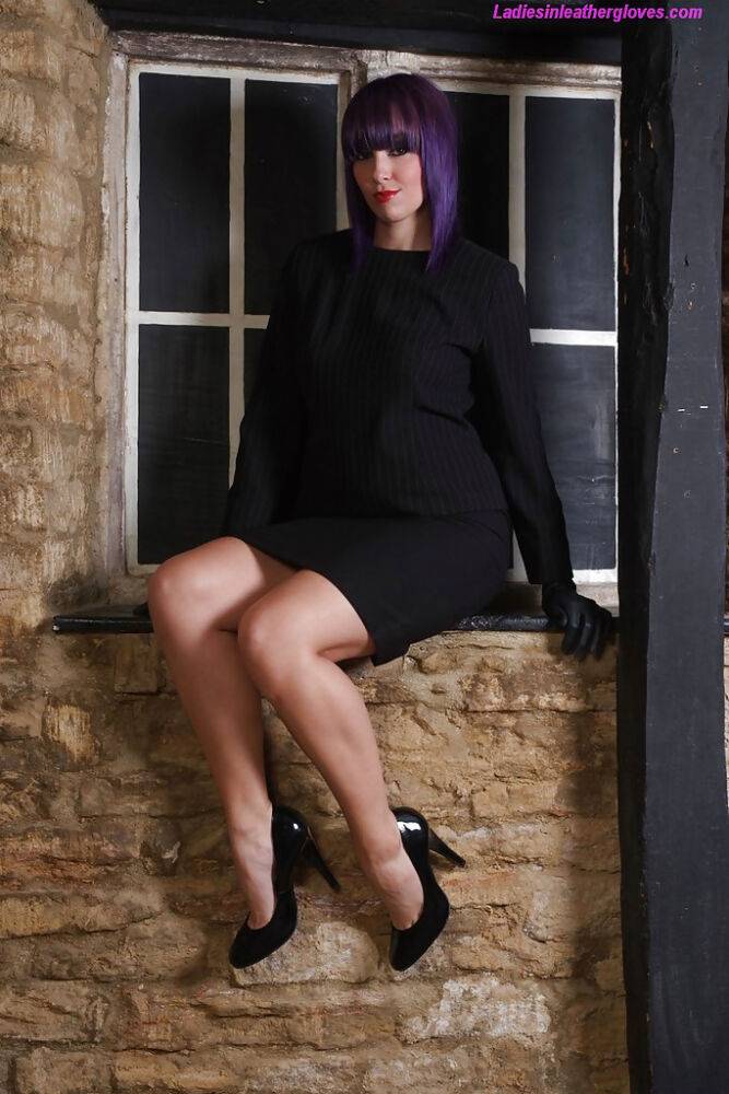 Pretty chick with purple hair poses fully clothed in black dress and pumps - #9