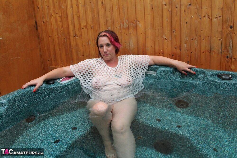 Plump amateur removes a mesh top while relaxing in an outdoor hot tub - #11