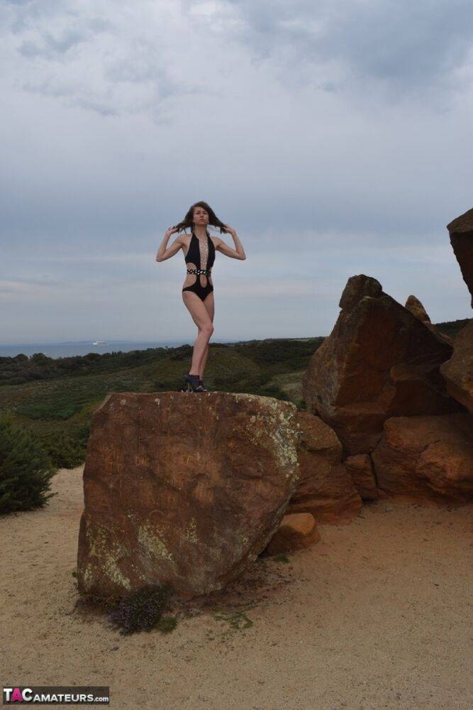 Amateur model gets naked in high-heeled footwear on iron ladened rocks - #16