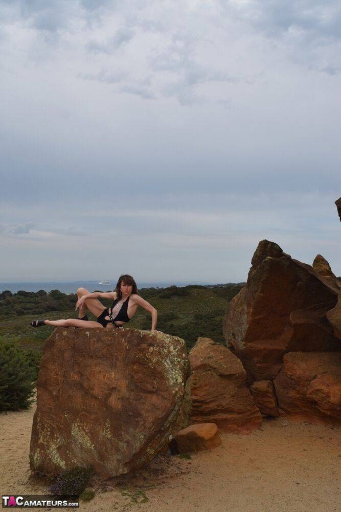 Amateur model gets naked in high-heeled footwear on iron ladened rocks - #13