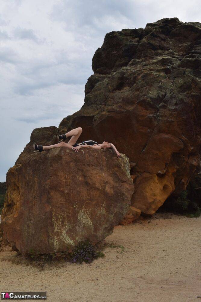 Amateur model gets naked in high-heeled footwear on iron ladened rocks - #3