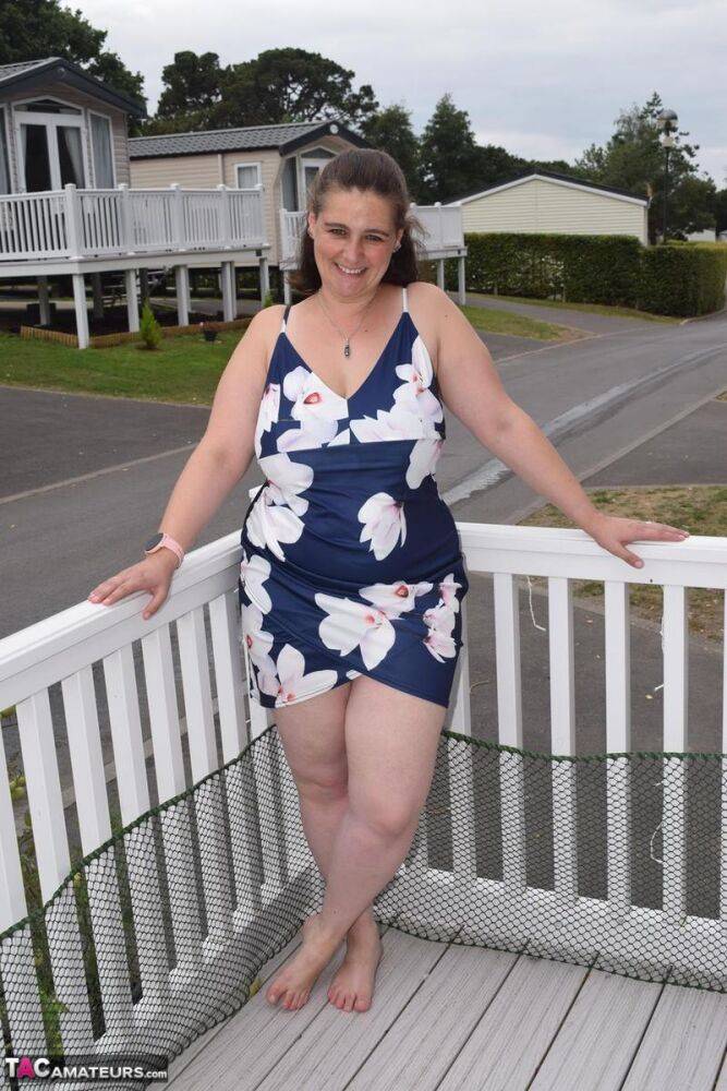 Middle-aged fatty exposes herself on a balcony in a public location - #9