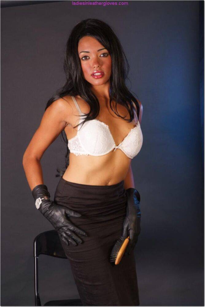 Hot black woman wields a hairbrush in black leather gloves and a skirt - #5