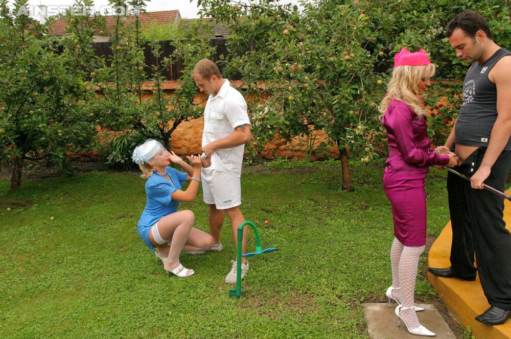 Clothed ladies stack their asses during a foursome fuck in the backyard - #3