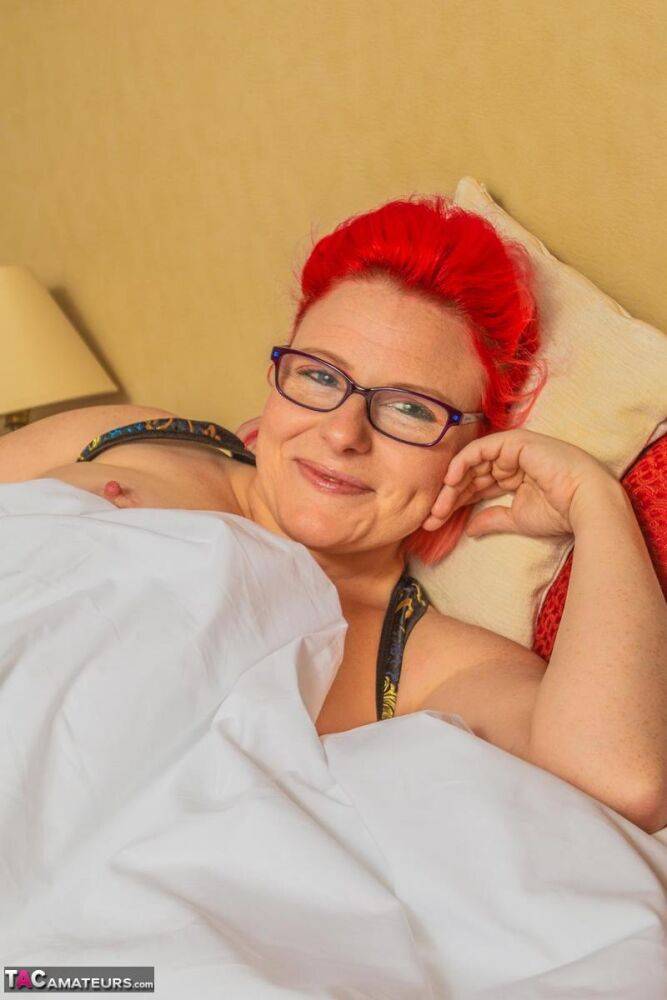 Amateur woman sports dyed hair and glasses while exposing her pierced pussy - #16