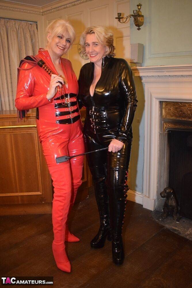 Mature lesbians get together in head-to-toe latex attire on a loveseat - #7