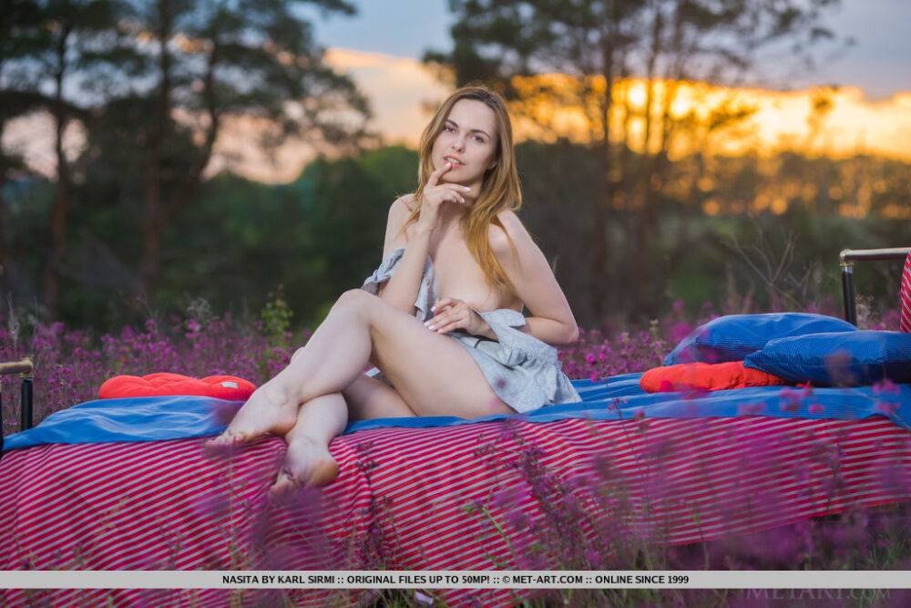 Caucasian teen Nasita disrobes for nude poses as the sun sinks in the sky - #10