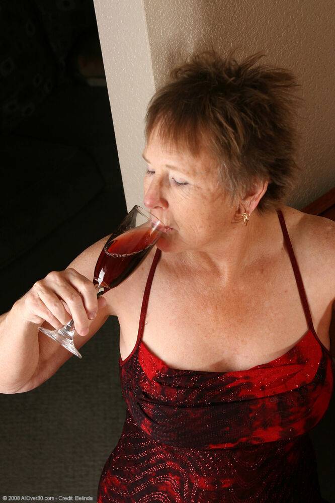 Old granny with big tits Sandra D doffs her red dress and poses nude - #3