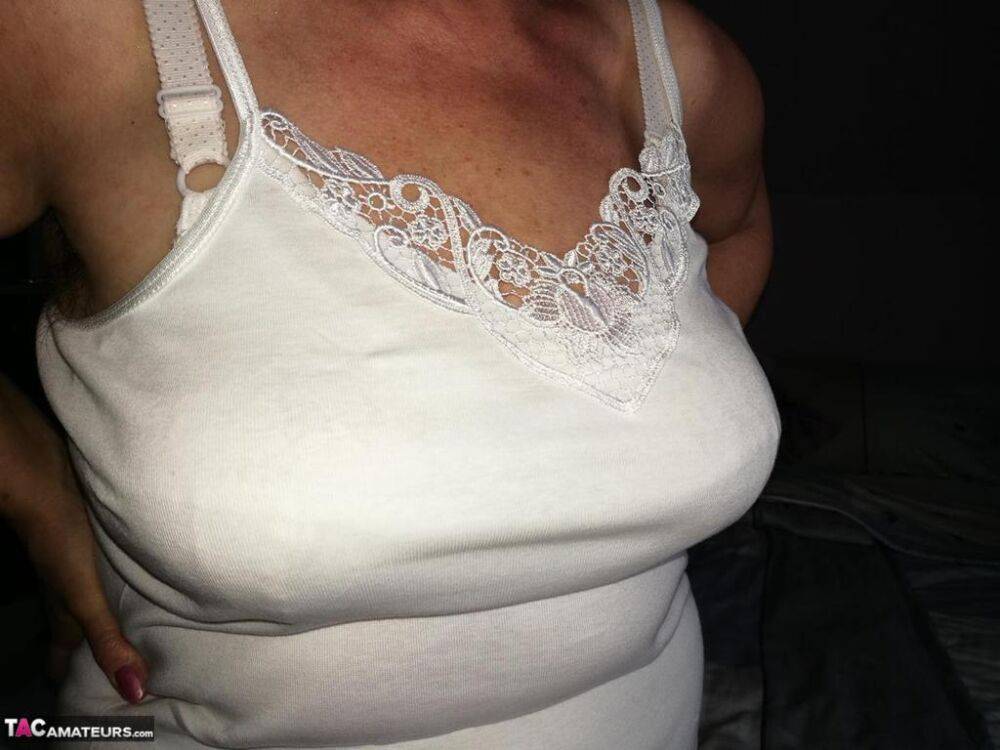 Naughty granny exposes her boobs while changing attire in nylons and heels - #11