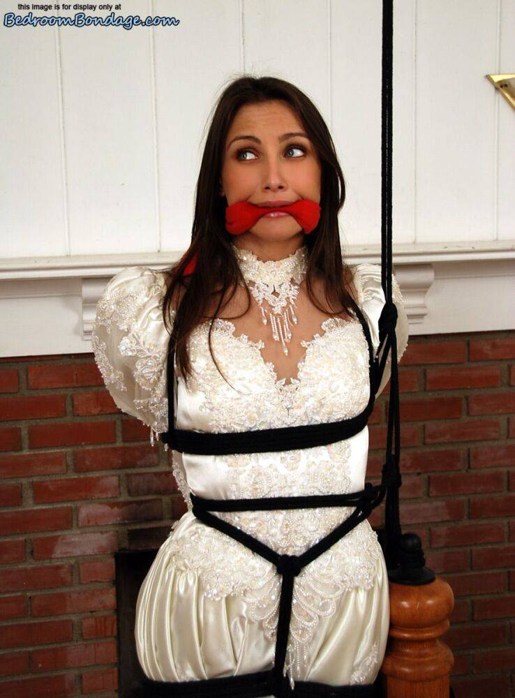 Brunette bride Celeste Star is ballgagged and tied up in her wedding dress - #9