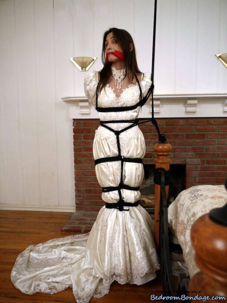 Brunette bride Celeste Star is ballgagged and tied up in her wedding dress - #7