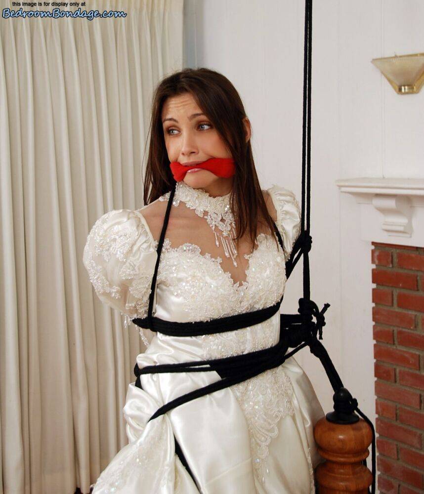 Brunette bride Celeste Star is ballgagged and tied up in her wedding dress - #5