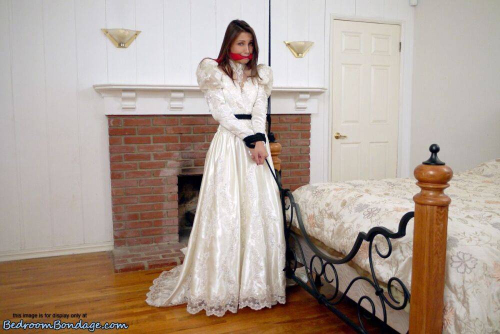 Brunette bride Celeste Star is ballgagged and tied up in her wedding dress - #2