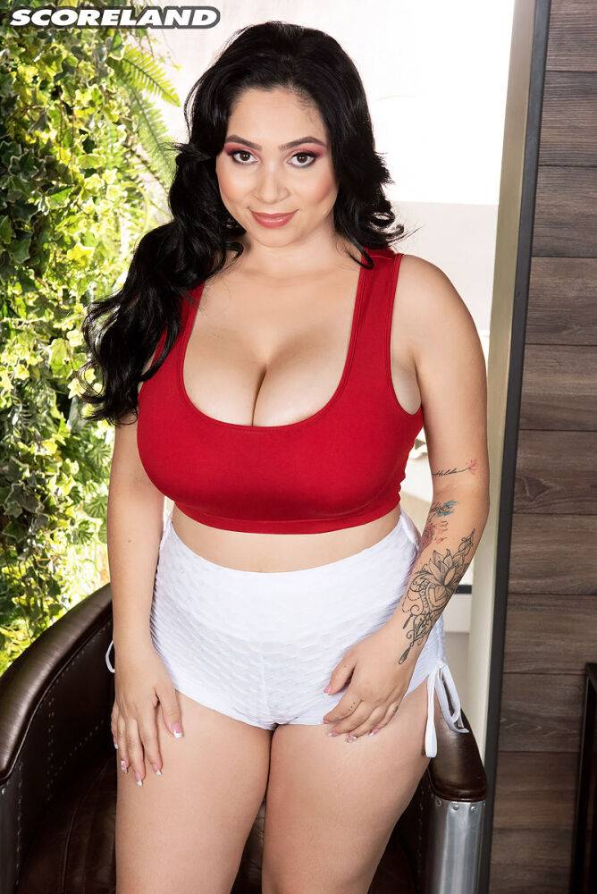 Thick Latina woman Kim Velez unleashes her big natural tits while disrobing - #7