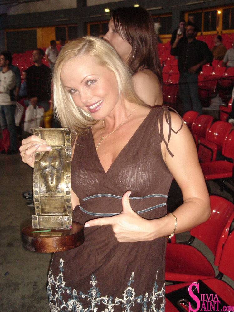 Blonde MILF Silvia Saint fully clothed posing & flaunting big tits at party - #14