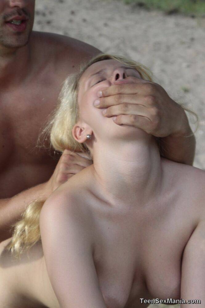 Young looking girl with natural blonde hair does anal on an outdoor blanket - #11