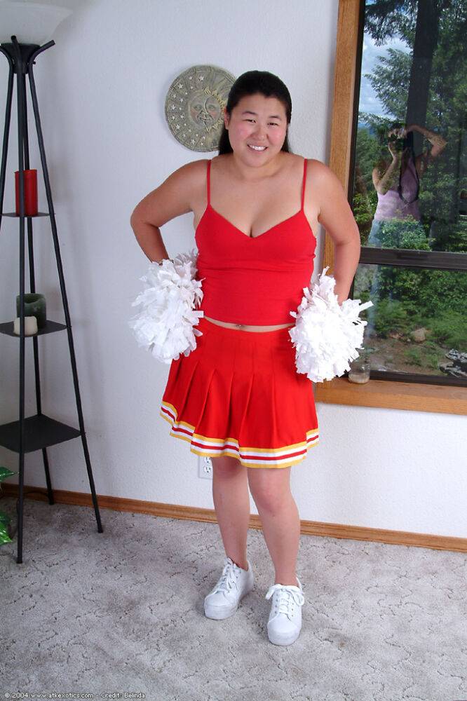 Chubby Asian first timer baring small boobs while shedding cheer uniform - #16