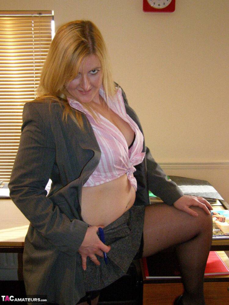 Blonde businesswoman Samantha pauses to play with her pussy on her desk chair - #4