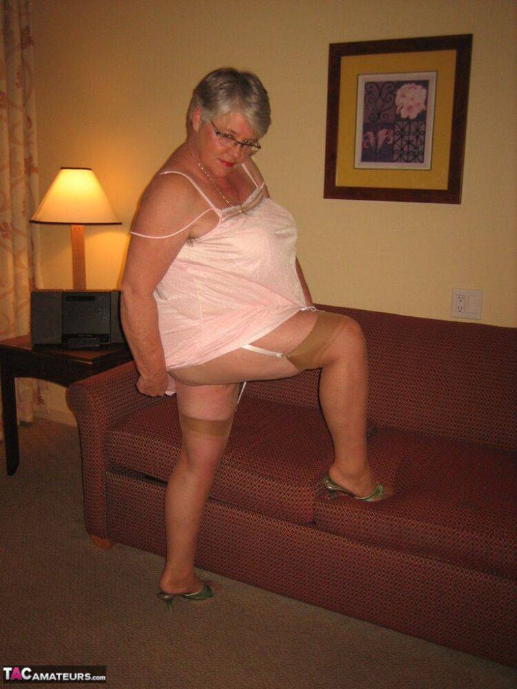 Amateur granny on the heavy side shows her pussy in lingerie and tan nylons - #14