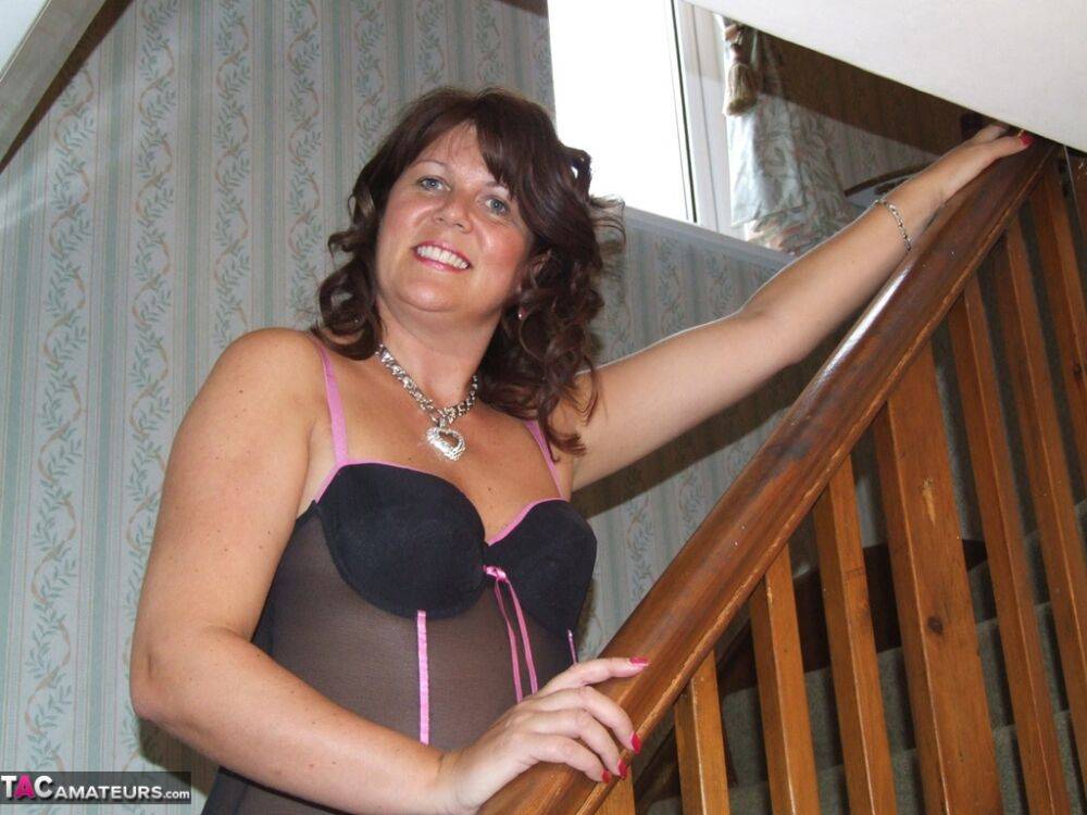 Busty horny housewife Sandy in sheer lingerie spreading pussy on the stairs - #2