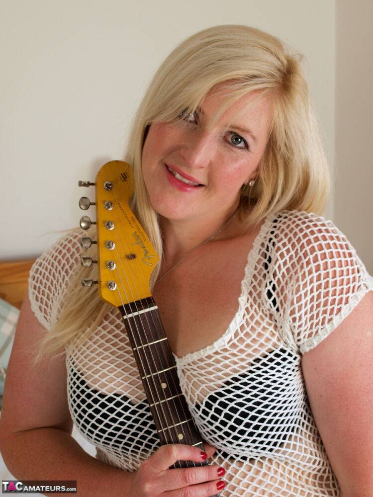 Blonde BBW Samantha touches her pussy while holding an electric guitar - #7