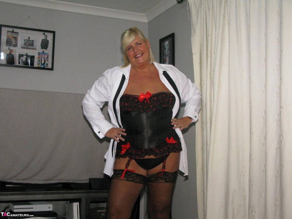 Older amateur Chrissy Uk parts her pussy lips in a corset and nylons - #13