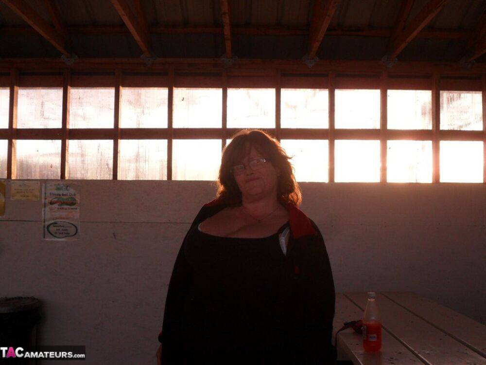 Overweight redhead Misha MILF exposes her tits & twat inside a building - #8