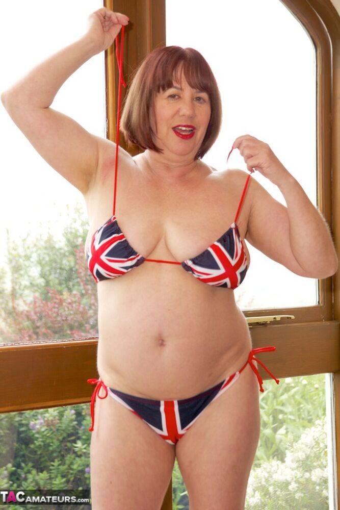 Older UK redhead Speedy Bee doffs a Union Jack bikini to get naked - #11