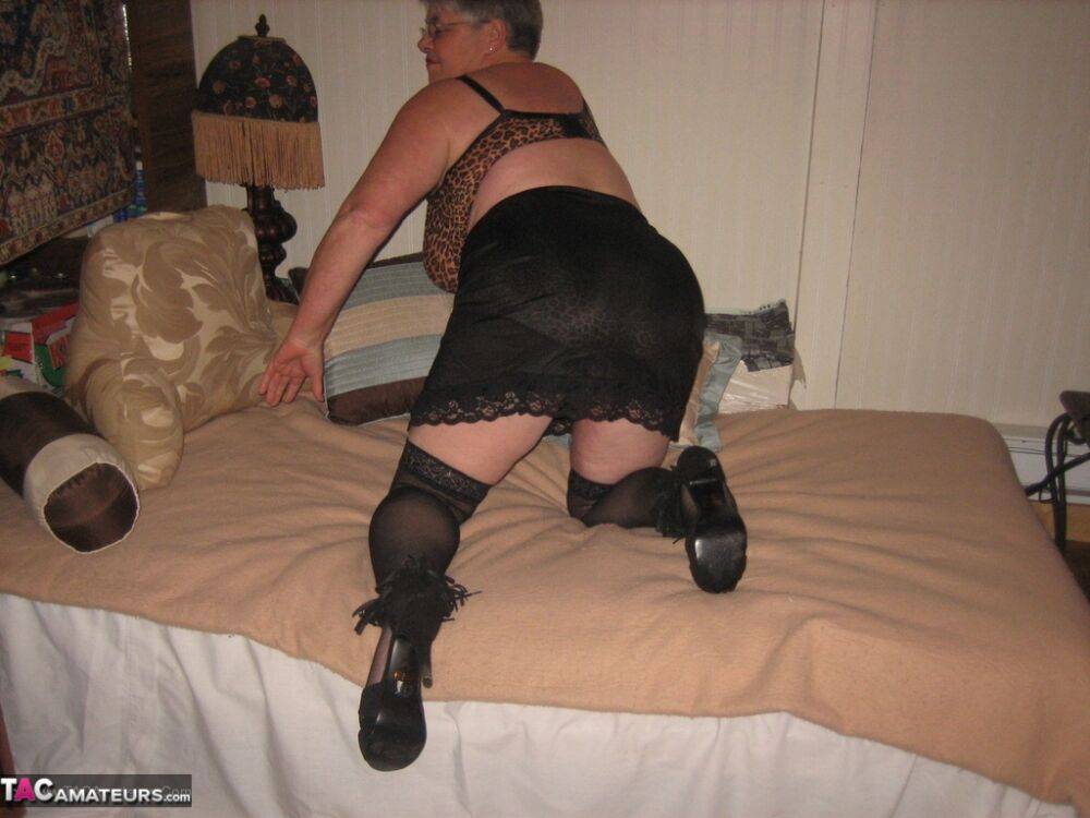 Silver haired granny Girdle Goddess masturbates on her bed in stockings - #8