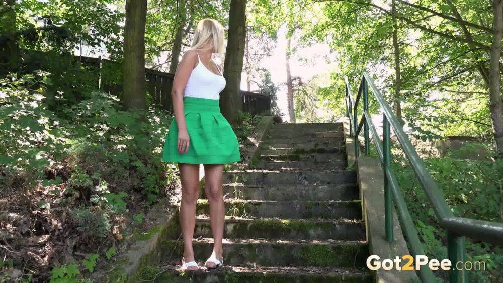 Blonde Nikki Dream in short skirt spreading legs and pissing in the forest - #4