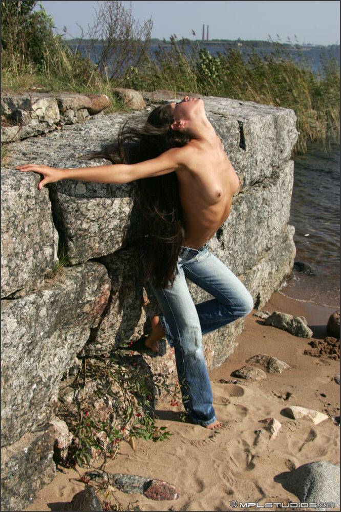 Brazen brunette beauty poses topless in jeans in the hot desert sun - #11