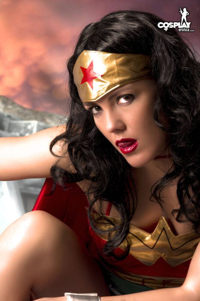 Beautiful brunette peels off her Wonder Woman outfit in a tempting manner - #10