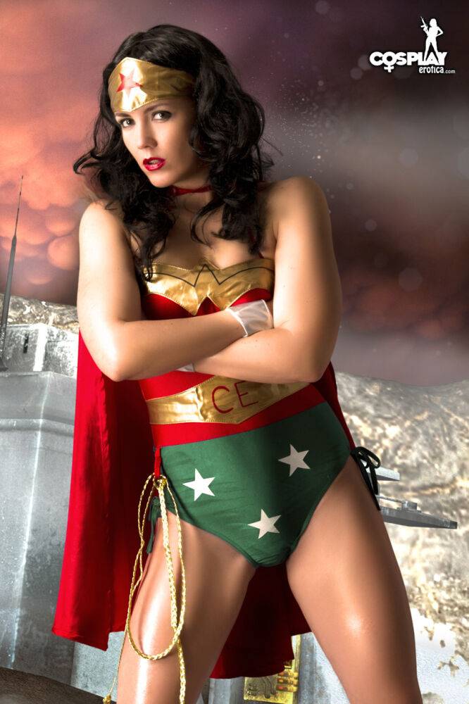 Beautiful brunette peels off her Wonder Woman outfit in a tempting manner - #6